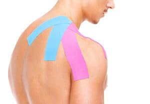 Idris is using Kinesio Taping on a very fit male in his Notting Hill Studio